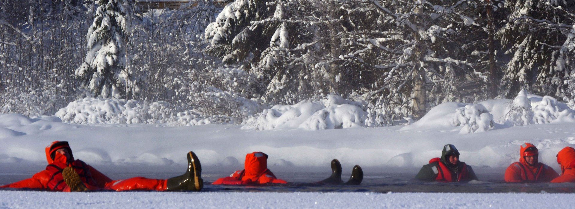 Exciting floating down the rapis - exotic swimming experience in snowy scenery